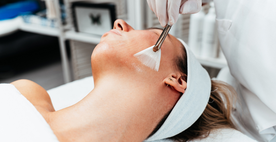 women Enhancing her skin with a chemical peel