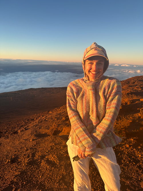 On windy mountaintop, Zoe NIkitas PA-C with K2 Dermatology