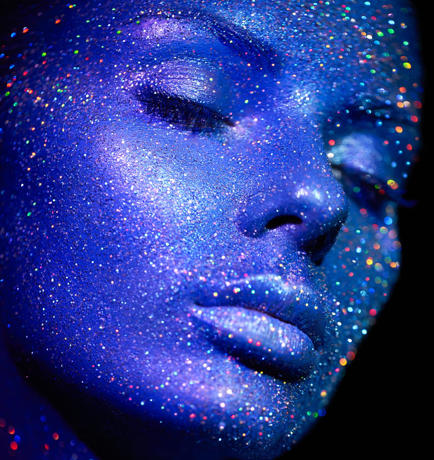 Fashion model woman in blue bright sparkles and neon lights posing in studio. Background for NIght of Beauty notice and signup