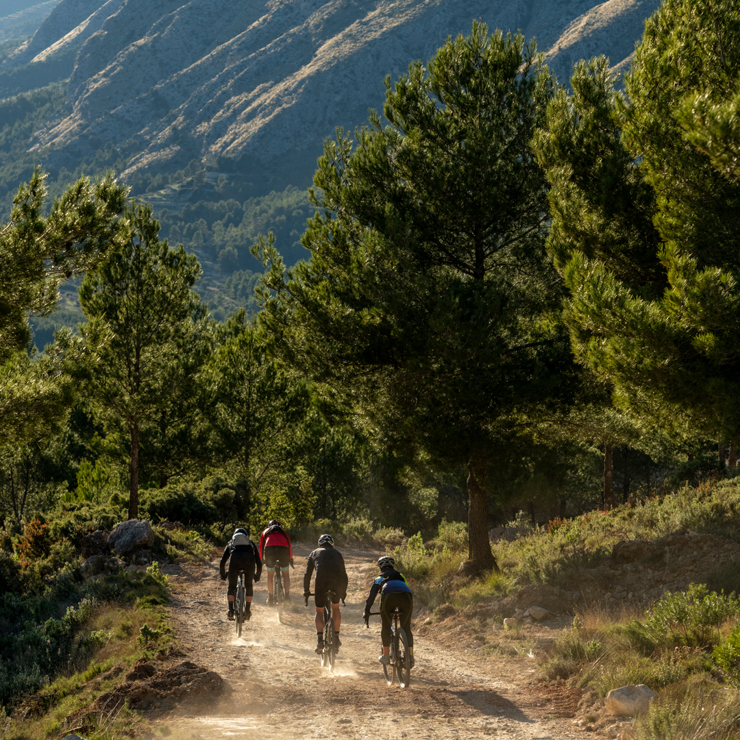 Group of people on mountain bikes riding in Boulder, CO protecting skin from harsh sun.